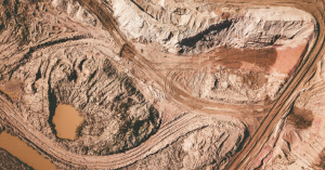 An aerial view of land that has been ruined by mining.